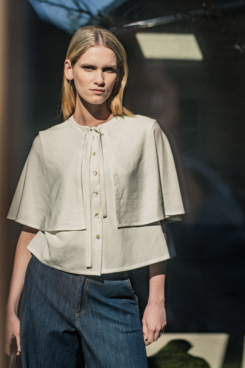 A photo of a finished Rima Blouse and Cape.