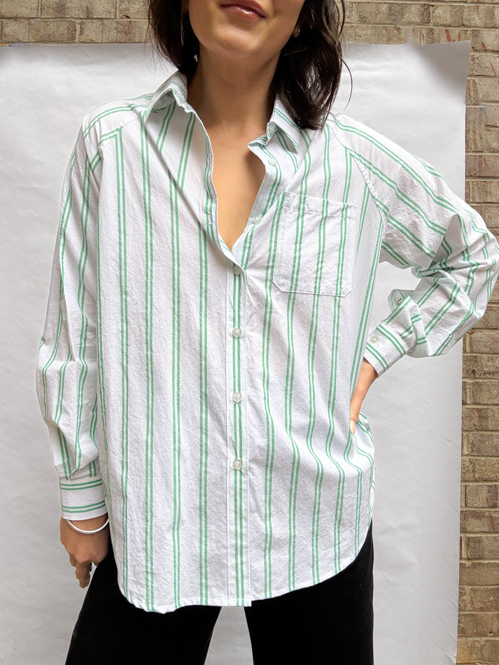A photo of a finished Rose Raglan Button-Up Shirt.